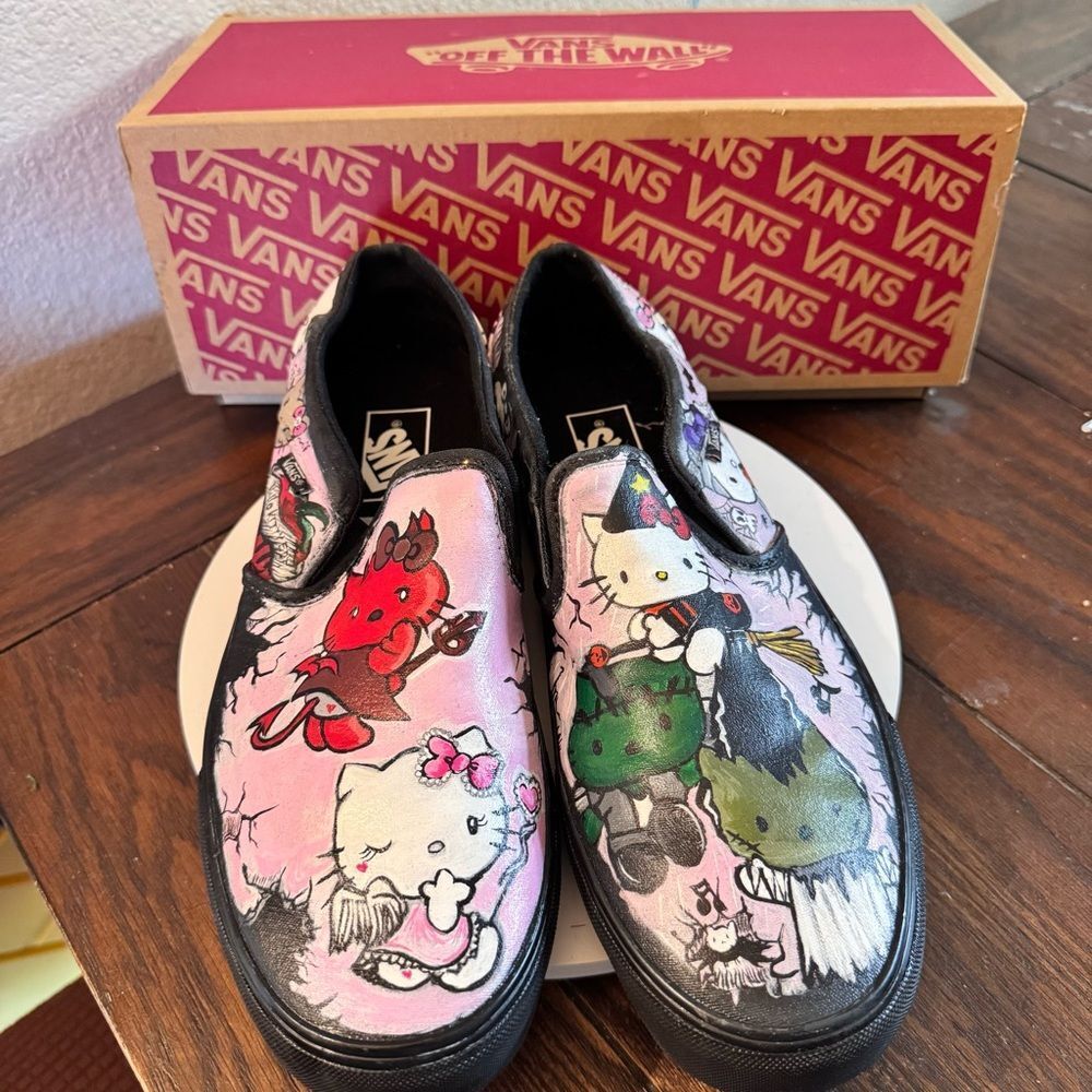 custom hand-painted Vans Slip-On sneakers featuring Halloween-themed Hello Kitty